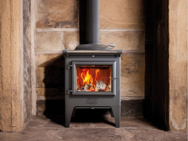 ESSE Warmheart in a large stone fireplace